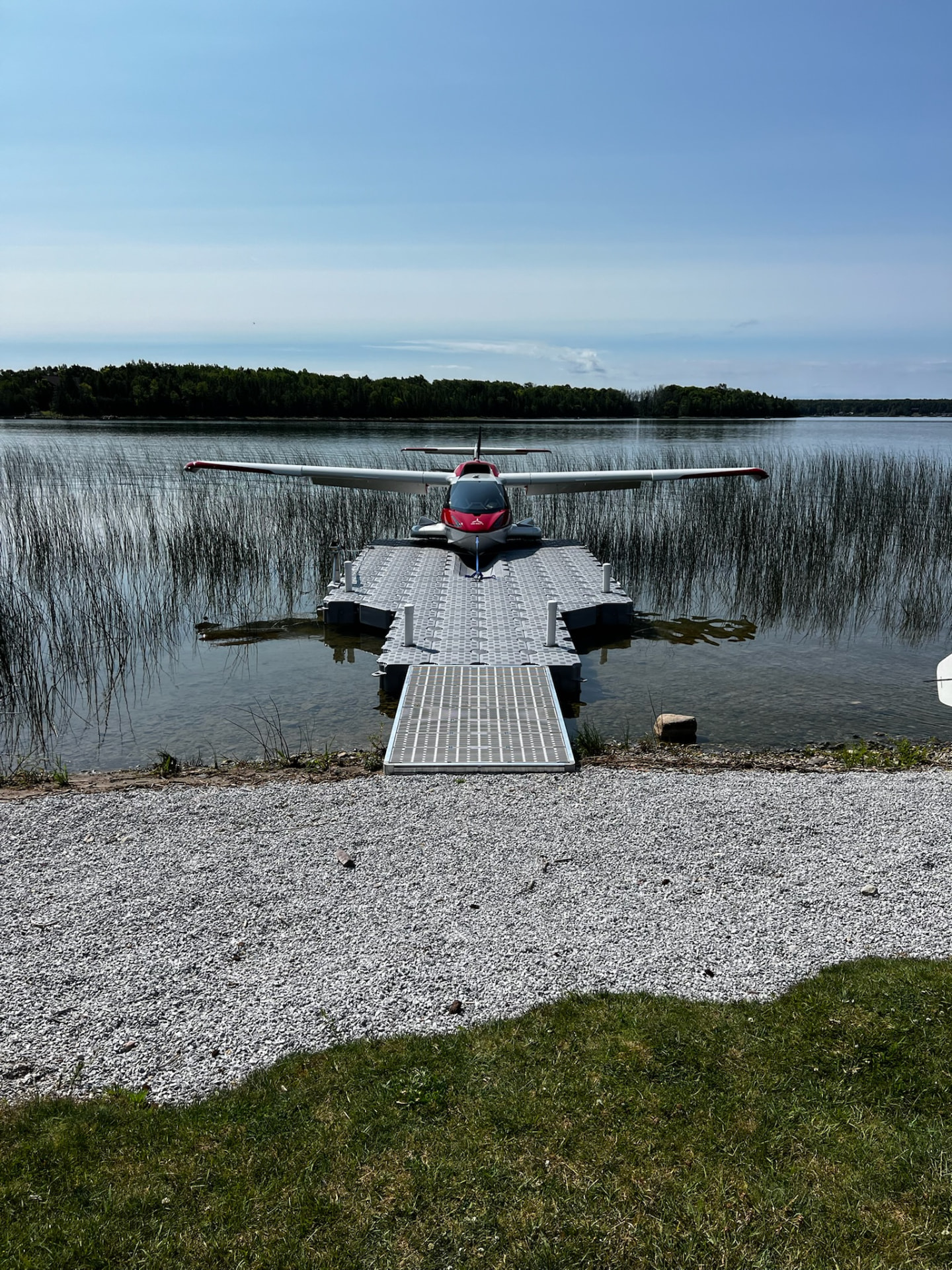 Seaplane docked on a CanDock modular floating dock system with a drive-on ramp